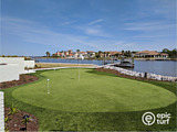 backyard putting green next to waterfront